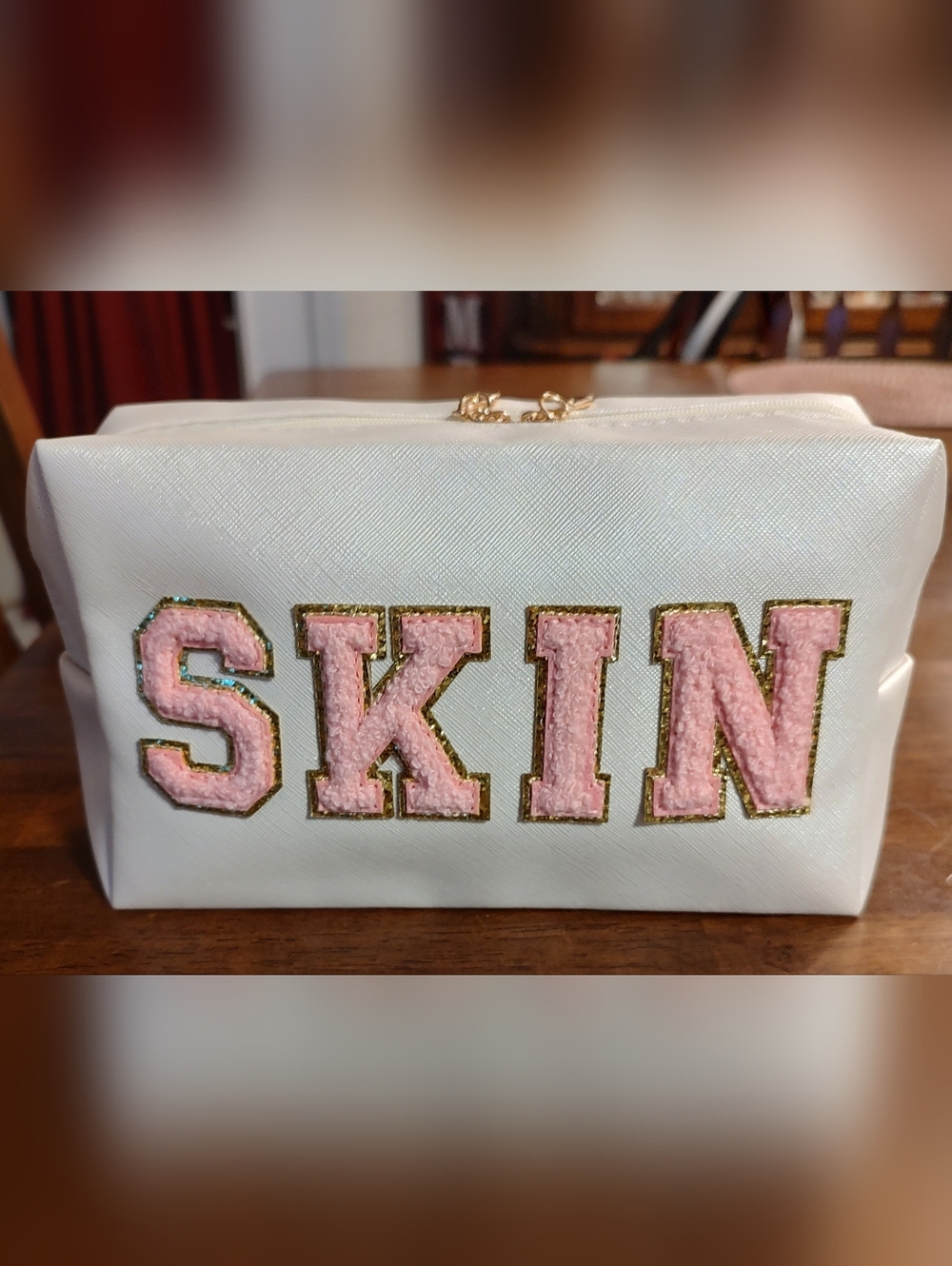 White Cosmetic Pouch with Pink 'SKIN' Lettering